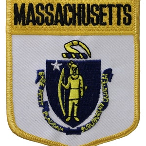 May include: A yellow and white embroidered patch with the state seal of Massachusetts. The seal features a blue shield with a yellow figure holding a bow and arrow. The text "ENSE PETIT PLACIDAM SUB LIBERTATE QUIETEM" is around the shield.
