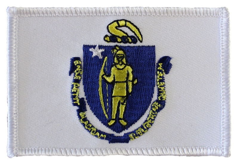 May include: White embroidered patch with the state seal of Massachusetts. The seal features a blue shield with a gold figure holding a bow and arrow, surrounded by the words "Ense petit placidam sub libertate quietem".