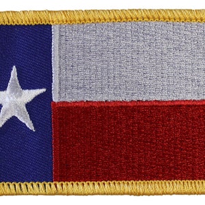 May include: Embroidered patch featuring the Texas state flag. The patch has a blue field with a white star, a white stripe, and a red stripe. The border is gold.
