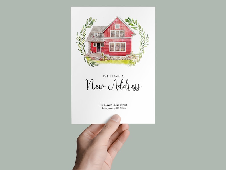 May include: A watercolour illustration of a red house with green trim and a white door. The house is surrounded by a wreath of green leaves. The text "We have a new address" is written below the house, followed by the address "7 S. Beaver Ridge Street, Perrysburg, OH 43551".