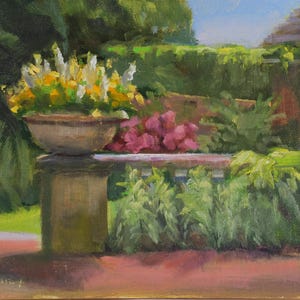 May include: An oil painting depicting a stone pedestal topped with a large bowl filled with yellow and white flowers. Behind the pedestal, a garden features pink blossoms, green foliage, a brick wall, and a structure with a white pillar.