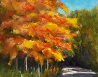May include: Oil painting of a vibrant autumn scene. The artwork depicts a tree with fiery orange and yellow leaves, set against a bright blue sky. A path leads into the scene, with green foliage on the right.