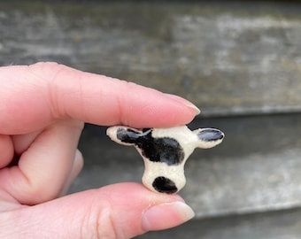 Handmade ceramic pin badge - cows