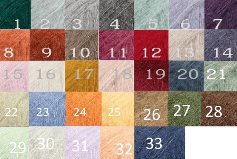 May include: A colour chart of 33 yarn samples. The samples are arranged in a grid of 7 columns and 5 rows. The yarn is a soft, fuzzy mohair blend. The colours range from dark green to light peach.