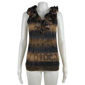 May include: A sleeveless brown and black tie-dye tank top with a large ruffled neckline.
