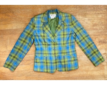May include: A blue, green, and yellow plaid blazer with a notched collar and three-button closure. The blazer has two front pockets and a green lining. The label reads "WORTH".