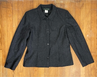May include: A dark gray blazer with a button-up front and a collared neckline. The label "Anne Klein" is visible on the collar.