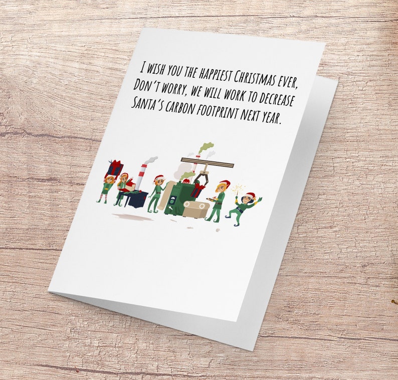 May include: A Christmas card featuring a cartoon illustration of elves working in a factory. The card reads "I wish you the happiest Christmas ever, don't worry, we will work to decrease Santa's carbon footprint next year."