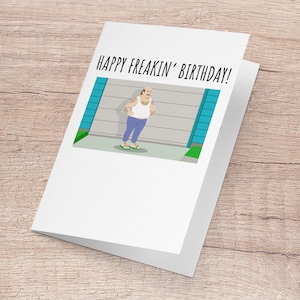 May include: A greeting card with a cartoon illustration of a man standing in front of a garage door. The card reads "Happy Freakin' Birthday!"
