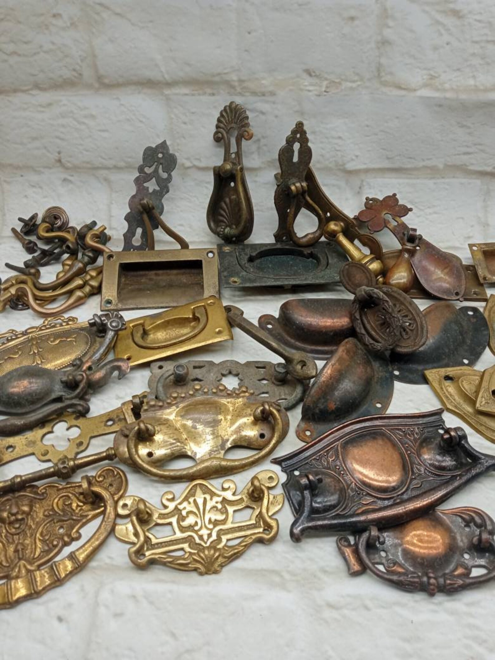 A large selection of antique original drawer handles mostly Etsy