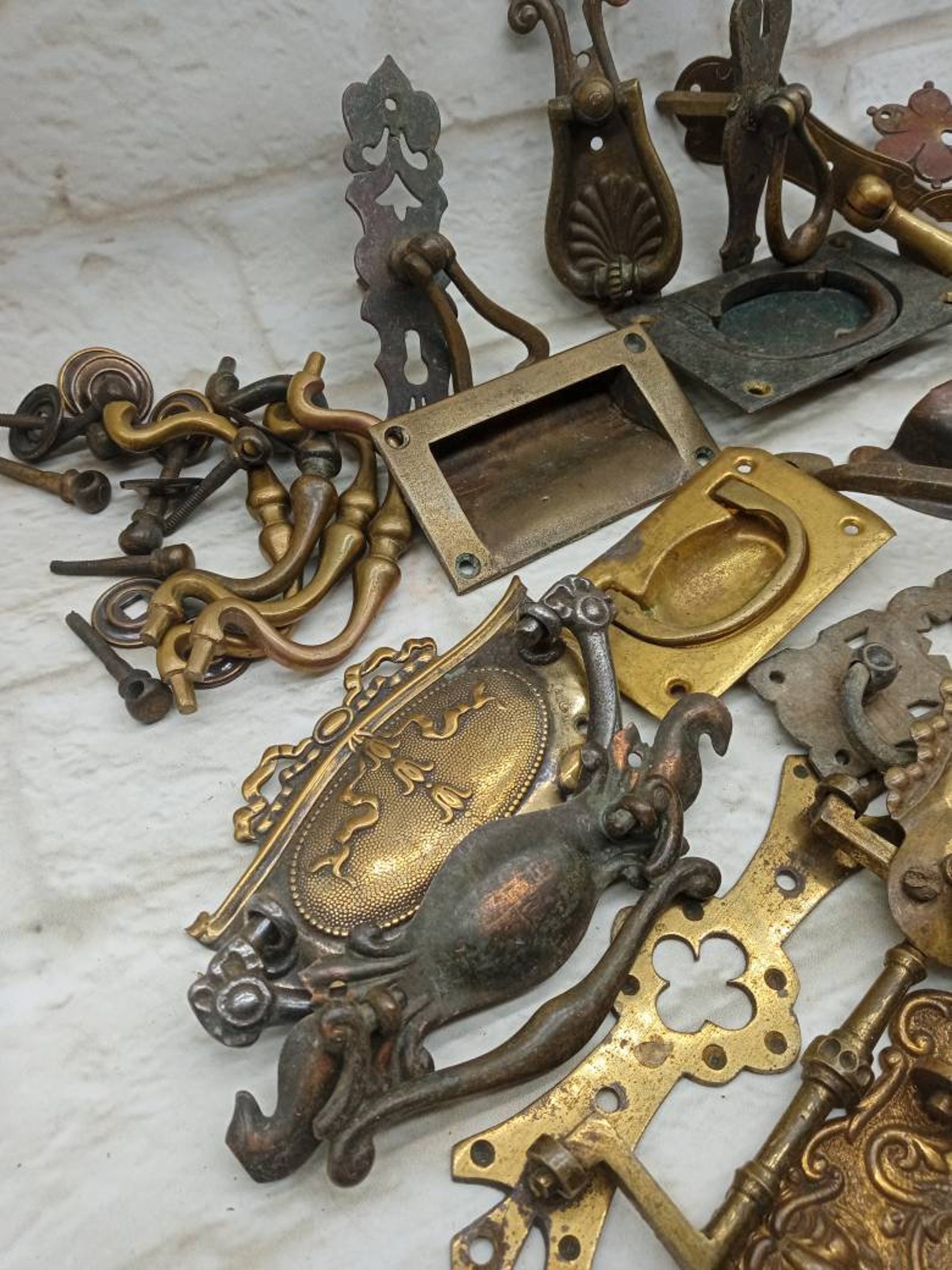 A large selection of antique original drawer handles mostly Etsy