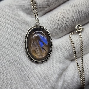 May include: A set of three ceramic mugs with a speckled, matte finish in cream, light grey, and dark grey. Each mug has a simple, minimalist design, ideal for tea or coffee.