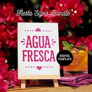 May include: A white sign on a wooden easel with the words "AGUA FRESCA" in pink. The sign is part of a "Fiesta Signs Bundle" and includes a digital template. A cocktail with ice and a sprig of mint is in the background.
