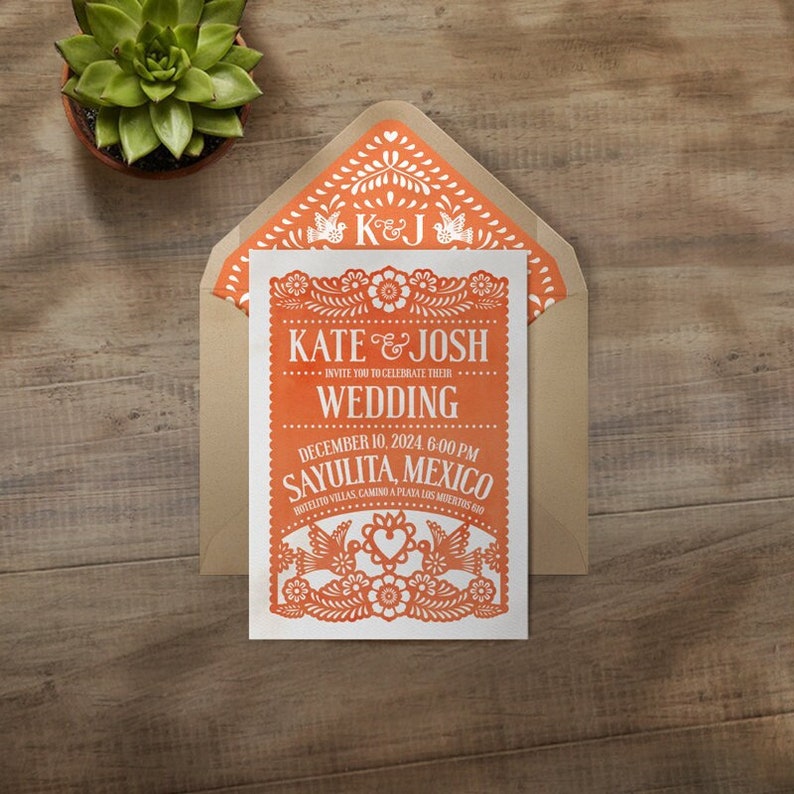 Papel Picado Wedding Invitation from I Invite You, featuring traditional papel picado shapes and decorations in colorful tones.