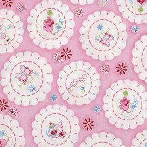 May include: Pink fabric with a repeating pattern of white circles with pink stitching. Each circle contains a different embroidered design, including a butterfly, a teapot, two birds, and a cat. The background is a solid pink color.