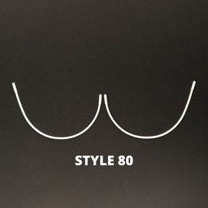 May include: White wire bra strap with the text "STYLE 80" on a black background.