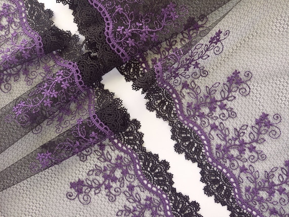 Non stretch black embroidered lace. Rigid mirrored lace sold in two symmetrical pieces only. 23 cm (9 1/16 in)