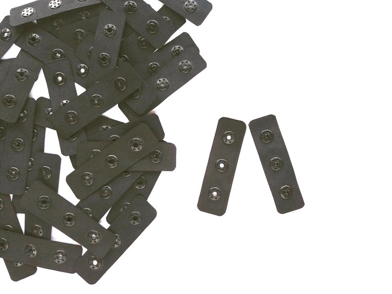 Black pre cut tape with plastic snaps