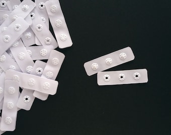 Snap tape with plastic snaps. Fastening bodysuits lingerie costumes baby clothes, heat sealed edges