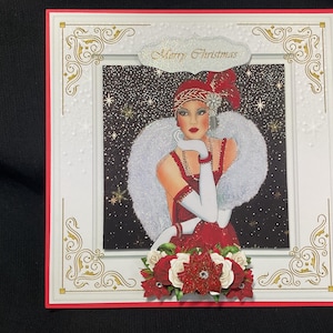 May include: A Christmas card featuring a vintage illustration of a woman in a red dress and white fur stole. The card has a red and white border with gold accents and the words "Merry Christmas".