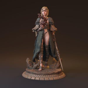 May include: A detailed figurine of a female warrior, dressed in green and brown attire, holding a stylized object. The figure stands on a decorative base, with a spear in hand. The design suggests a fantasy or mythological theme.