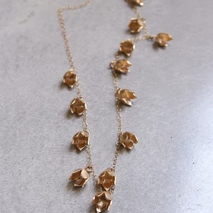 Gold buds necklace.  Long flower statement necklace. Designer handmade necklace. Simple elegant and delicate.