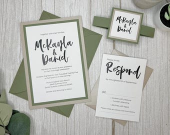 May include: A wedding invitation suite with a green envelope and a white card with the names "Mckayla & Daniel" in black script. The RSVP card is white with a black script font that says "Please Kindly Respond by the eighteenth of September".