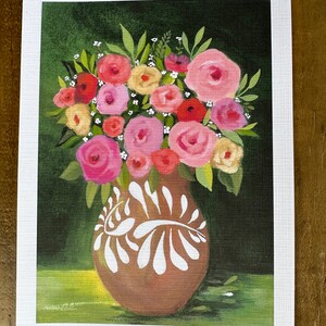 May include: A floral painting featuring a brown vase with white decorative accents, filled with a bouquet of pink, red, and yellow roses and greenery. The background is a dark green, with a light green area at the bottom.