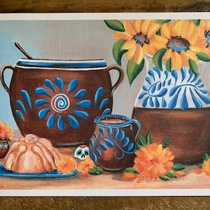 May include: A still life painting of a brown earthenware pot with blue and white designs, a smaller brown earthenware mug with blue and white designs, a brown earthenware pitcher with blue and white designs, a light brown cake with a swirl design, a sugar skull, and orange marigold flowers.
