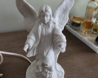 Guardian angel night light....white....porcelain bisque...good condition