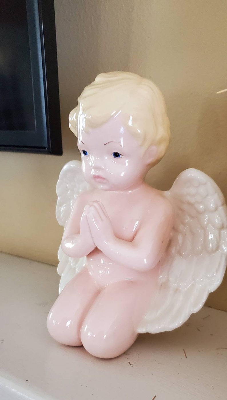 Porcelain angel...vintage...nicely detailed...glazed....praying
