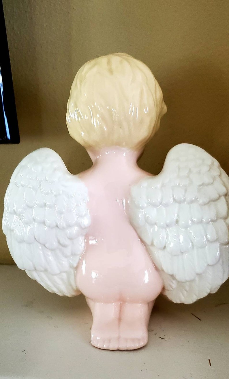 Porcelain angel...vintage...nicely detailed...glazed....praying