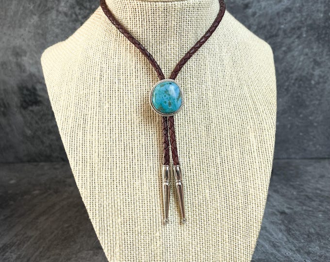 Bolo Handmade with Kingman Turquoise, 4mm Leather Braid, Handmade 925 Sterling Silver Setting, Silver Tome Tips. 42 inch.