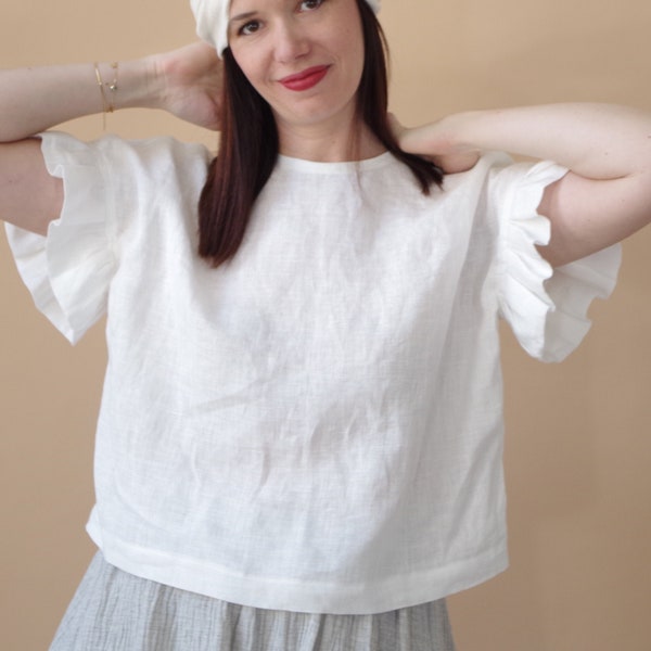 Oversize blouse with frilled sleeves in organic white linen.  Custom made upon request