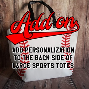 May include: White canvas tote bag with a red baseball graphic and the text "Add on" in red. The text "ADD PERSONALIZATION TO THE BACK SIDE OF LARGE SPORTS TOTES" is printed below the graphic.