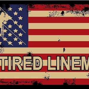May include: A distressed American flag with a silhouette of a lineman working on a power line. The text "RETIRED LINEMAN" is printed below the flag.
