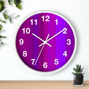 May include: A white clock with black numbers and hands on a purple and blue gradient background.