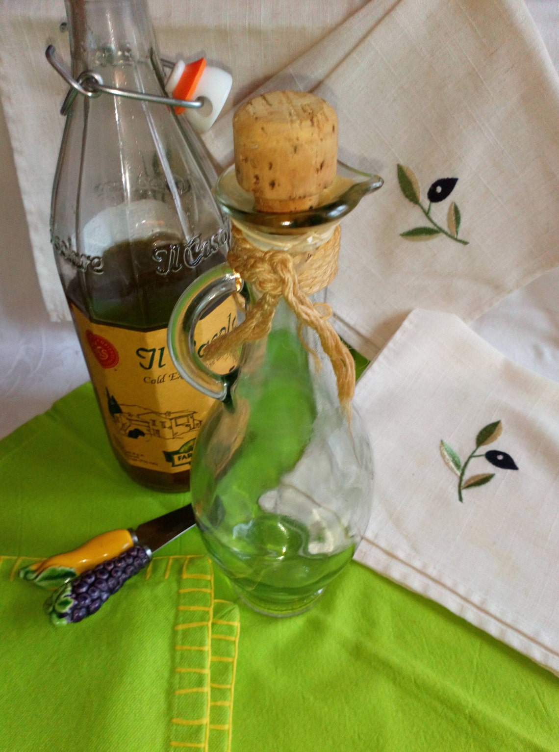 Vintage glass olive oil jug with cork stopper. Decorated with Etsy