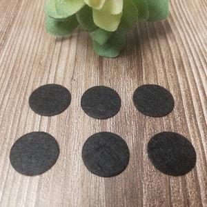 Small black round felt pad refills for essential oil diffuser necklace.  Refill pads for aromatherapy.