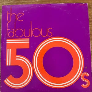 May include: A vintage vinyl record album cover with a purple background. The words "the fabulous" are in a stylized orange font at the top. The number "50" is in a large orange font with white stripes, and the letter "s" is at the bottom.