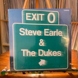 Steve Earle and The Dukes vinyl record album “Exit O”