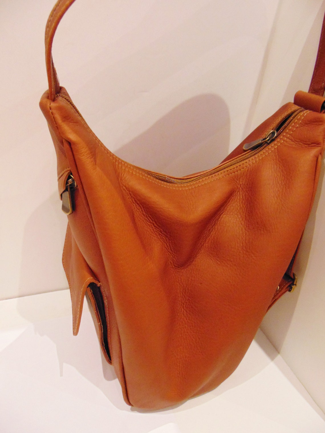 small tan leather backpack