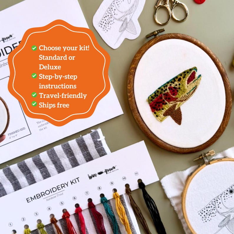 May include: An embroidery kit featuring a wooden hoop with a stitched rainbow trout, a second hoop with a trout outline, a thread organizer with numbered colored floss, a striped fabric piece, and an instruction sheet with text.