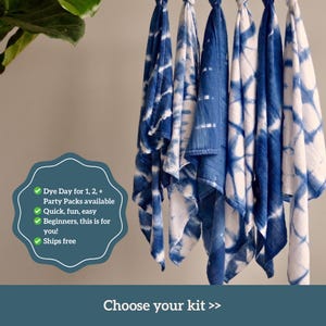 Beautifully patterned tie dye tea towels hanging up on display. Made using a natural indigo dye kit for beginner crafters as a unique bridal shower activity or bachelorette favor.