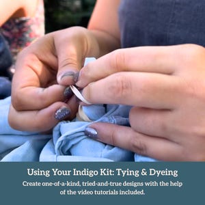 May include: A person's hands are shown tying a rubber band around a light blue fabric, preparing it for dyeing. The image is part of a tutorial for an indigo kit, with text that reads "Using Your Indigo Kit: Tying & Dyeing."