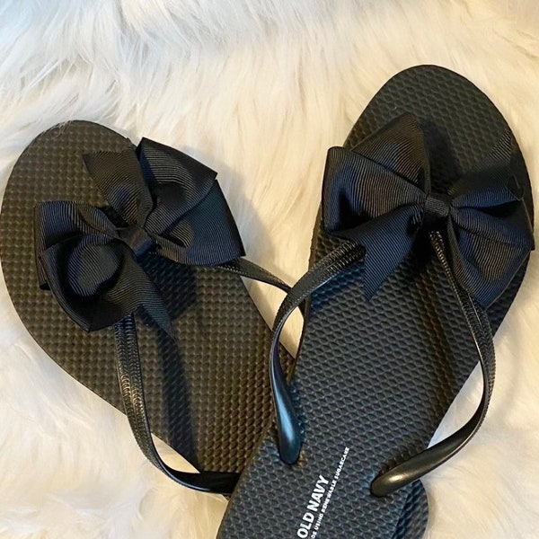 Women’s Black Flip flops with 4 inch pinwheel bow