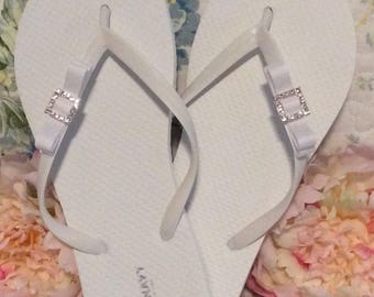 Womens flip flops, white or black with rhinestone buckle and bow, summer thongs, poolside sandal, beach wear, bridal flip flop, gift for her