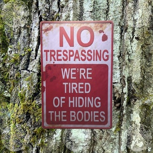 No Trespassing We Are Tired of Hiding the Bodies Tin Metal Sign