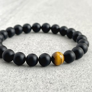 matte onyx beaded bracelet with a single yellow tiger eye bead, beaded bracelet for men, man bead bracelet, men's bracelet, man bracelet, men's beaded bracelet, stretch bracelet for men, crystal bracelet, made with strong stretchy cord