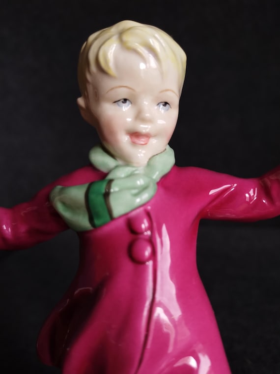 Royal Worcester JANUARY'S CHILD Boy Figurine: Boy Gliding on Ice, Freda Doughty Design - Hand Painted Bone China Collectible
